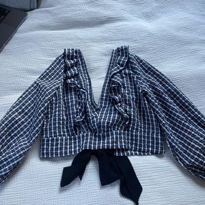 Top shop backless shirt with bows in the back.